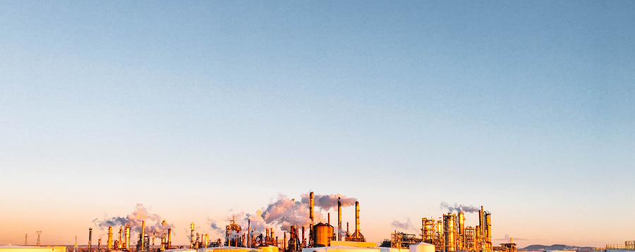 image of oil refineries at sunset